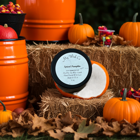 Pumpkin spice candle styled in a rustic pumpkin patch with vibrant orange pumpkins, cozy autumn vibes, and seasonal fall décor – eco-friendly soy candle perfect for fall collections.