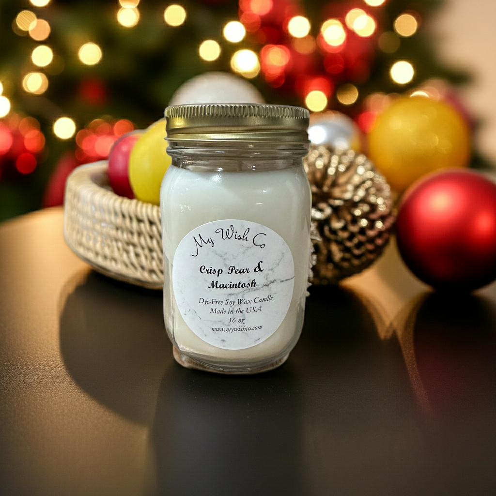 Jar of candle with 'My Wish Co' label in front of Christmas decorations
